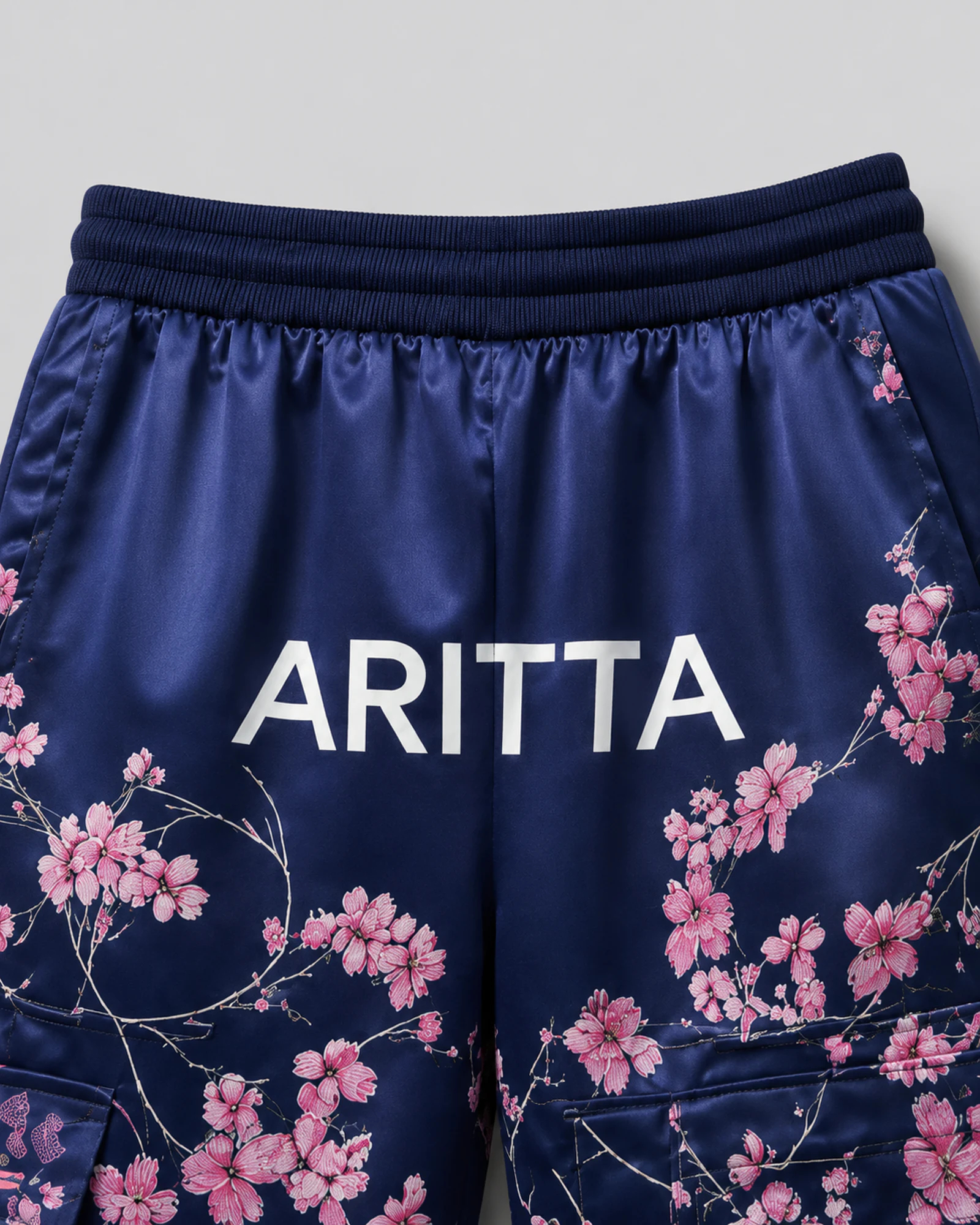 Detail of the waistband, ARITTA logo and floral print